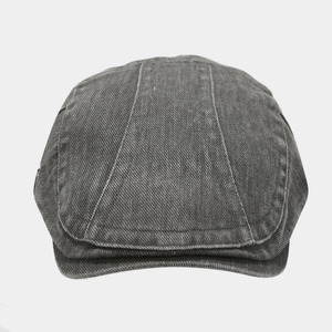 Front view of vintage dark grey denim newsboy cap with retro stitched paneled crown