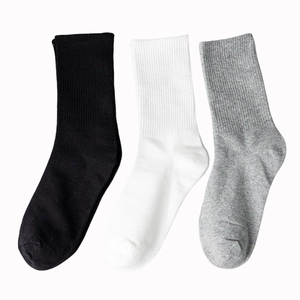 Three pairs of breathable cotton crew socks in black, white, and gray colors