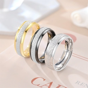 Frosted titanium steel rings in gold, black, and silver with a sparkling stardust finish