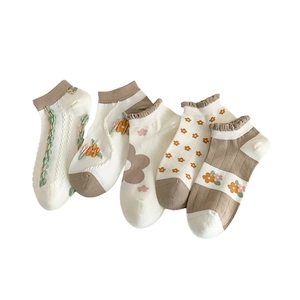 Five pairs of women's combed cotton ankle socks in earth tones with knit details