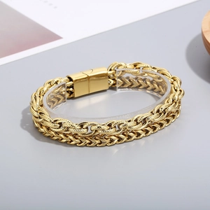 Detail of gold double-layer stainless steel chain bracelet with secure magnetic clasp
