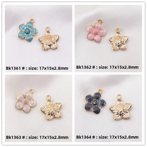 Detailed macro view of 17x15mm cherry blossom alloy enamel charms in four colors