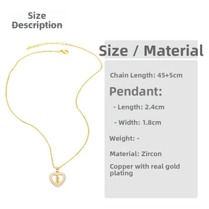 Detail of Virgin Mary pendant with gold-plated copper and white zircon frame on thin chain