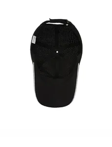 Detail view of the breathable mesh lining and white inner piping of the black baseball cap