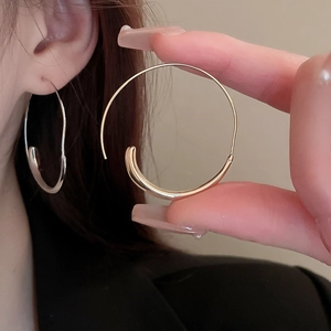 Chic gold and silver oversized geometric hoop earrings with polished metallic finish