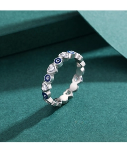 Detailed shot of S925 silver ring featuring heart zircons and blue enamel evil eye charms