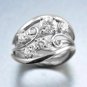 Vintage vine leaf hollowed ring with layered silver bands and sparkling round diamonds