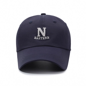 Classic dark blue cotton baseball cap featuring white N letter embroidery and curved brim