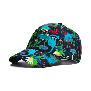 Close-up of navy blue dinosaur print baseball cap with vibrant tropical patterns