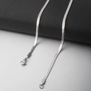 Detailed view of silver titanium steel flat snake chain with a secure lobster clasp