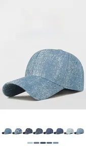 Detail view of tie-dye denim baseball caps showing multiple colors and rhinestone patterns
