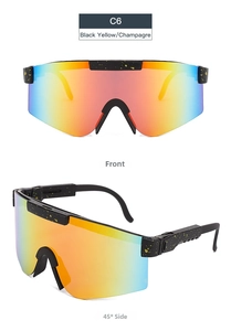 Detail view of large-frame cycling sunglasses with black-yellow frame and colorful gradient lenses