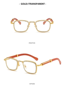 Detail of square gold metal sunglasses with diamond-set frames and red wood grain temples