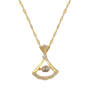 Luxurious gold skirt-shaped pendant necklace with sparkling diamonds on a gold lip chain