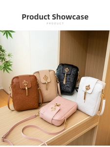 Multiple sweet embossed crossbody bags with gold crown locks and tassel details on display