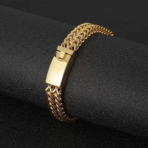 Detailed close-up of a double-row gold-plated wheat chain bracelet with press buckle