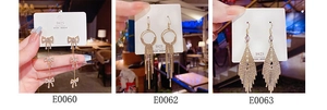 Detailed view of three gold S925 silver needle tassel earrings with zircon accents