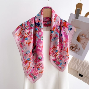 Elegant pink floral silk scarf on a white mannequin with abstract flower patterns