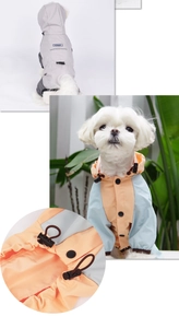 Close-up of waterproof dog raincoat featuring adjustable drawstring hood and secure button closure