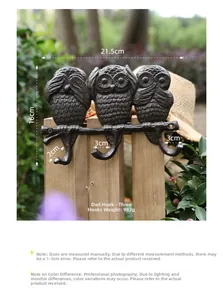 Detailed view of heavy duty cast iron wall hook with three vintage owl figures