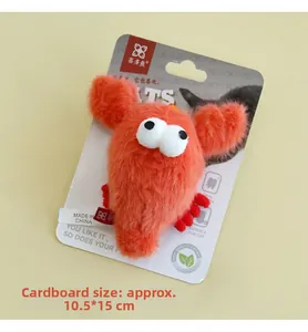 Detail of red plush lobster cat toy with catnip and bell on original packaging