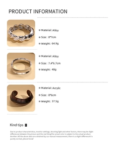 Detailed specs of silver twisted alloy and brown acrylic geometric bangles with weights