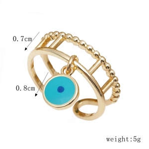 Detail showing dimensions of double-layered gold evil eye ring with dimensions