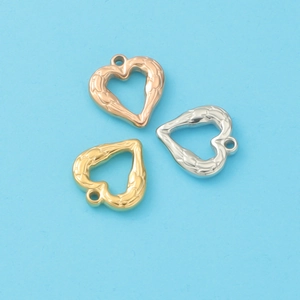 Three textured heart charms in rose gold, gold, and silver finishes on blue background