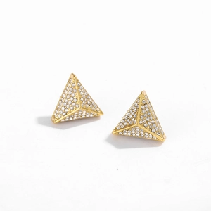 Detailed view of pyramid shaped gold stud earrings featuring paved white cubic zirconia