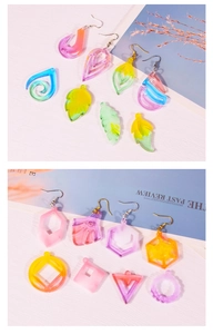 Detail of colorful gradient resin earrings in leaf and geometric shapes for DIY jewelry