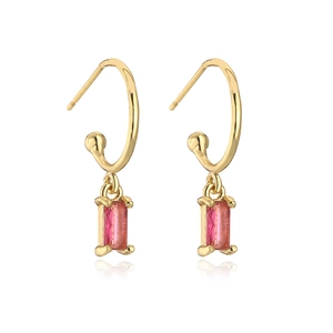 Detail of gold-plated C-shaped earrings with rectangular pink zircon stone pendants
