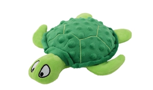 Close-up of green plush turtle dog toy showing textured shell and soft fabric material