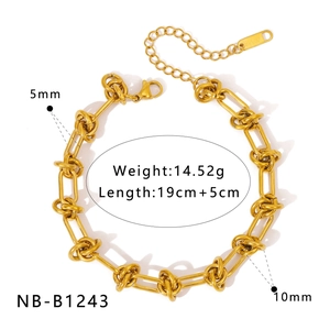 Detailed view of gold snake chain bracelet with knot design and size measurements