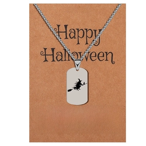 Halloween stainless steel tag necklace featuring a witch silhouette on card packaging