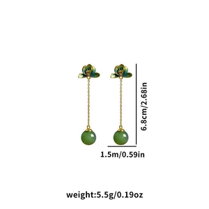 Detailed view of vintage jade lotus earrings showing size measurements and emerald green beads