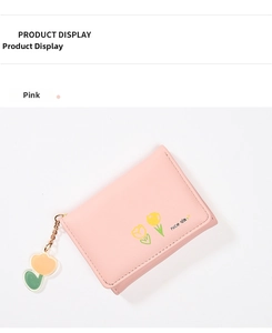 Close-up of pink vegan leather wallet with tulip print and a cute floral pendant charm
