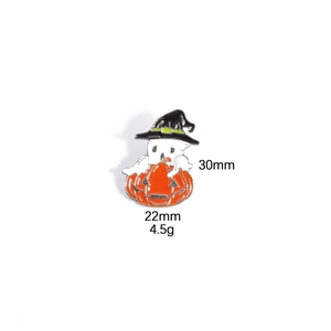 Detail view of ghost and pumpkin enamel pin showing dimensions 30mm height and 22mm width
