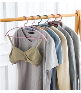 Detail of semi-circular non-slip plastic hangers in multiple colors for home organization
