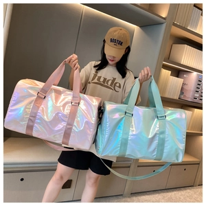 Detail of pink and light blue gradient duffel bags with laser reflective surface