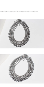 Detail view of five-layered metallic gray pearl necklace with silver lobster clasp
