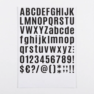 Close-up of black bold alphabet and number stickers for DIY crafts and greeting cards