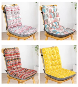 Close-up of four colorful patterned chair cushions with quilted texture and ties