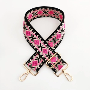 Macro shot of 5cm ethnic diamond pattern woven strap with gold metal lobster clasps