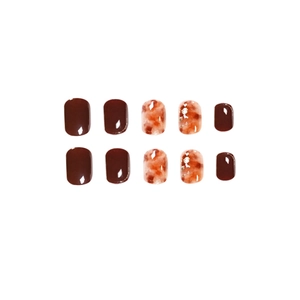 Short square press-on nails in amber marble brown finish with silver glitter flakes