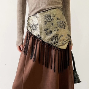 Detail of vintage style rose print tassel waist wrap with gold metallic finish