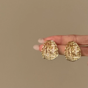 Vintage gold plated oval stud earrings with textured finish for a minimalist luxury look