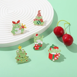 Set of five cute cartoon Christmas frog enamel pins with festive holiday decorations