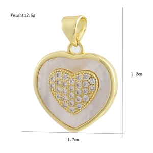 Detailed view of a gold heart pendant with white shell and zircon stones, 2.2x1.7cm