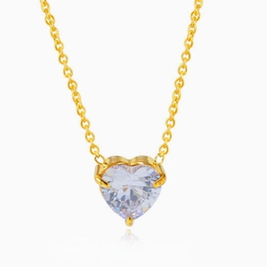 Detail of gold titanium steel necklace featuring a sparkling heart-shaped zircon pendant