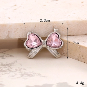 Detail of pink crystal bow shoe charm accessory with 2.3cm measurement and silver finish
